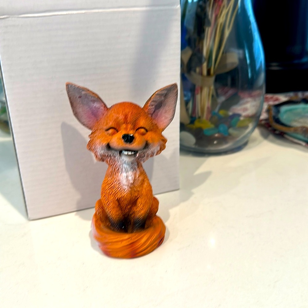 Laughing fox figurine